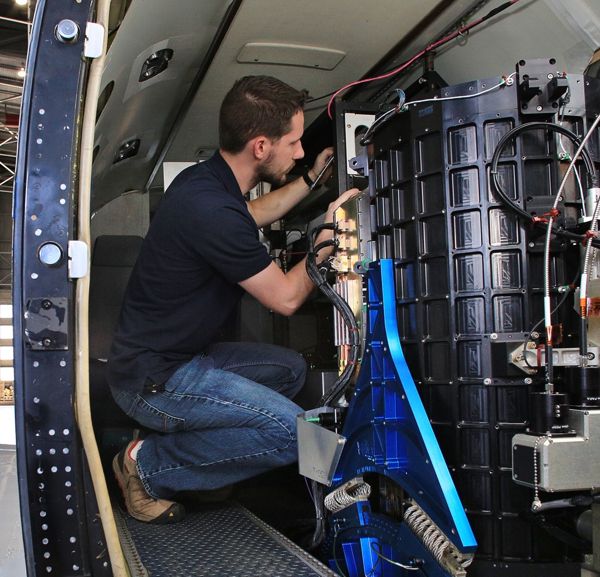 Engineer Richard Martin installing the SABOR instruments on the King Air, UC12. Photo taken 06/02/14 by David C. Bowman/NASA Langley